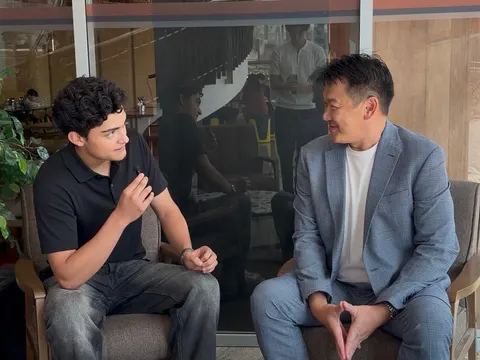 Me interviewing Andy Toh, seated across a low table, during the summer program in Singapore
