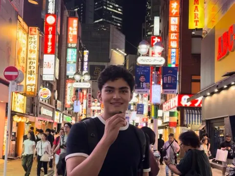 Me in Shibuya at night, while filming the video on Japan's economic data