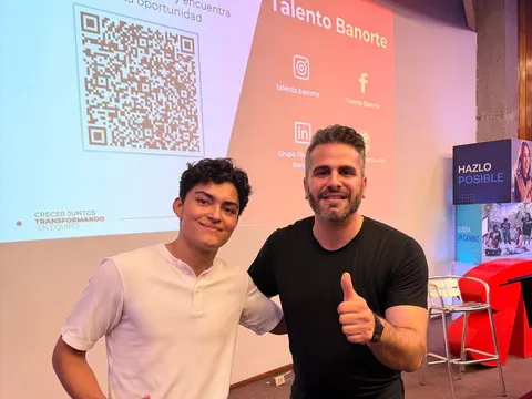 Me next to Moris Dieck at a financial education event in Mexico